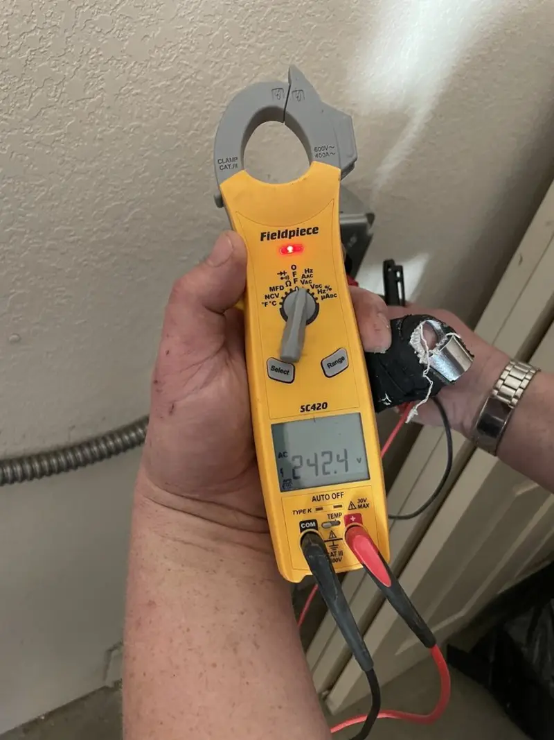 Voltage testing with clamp meter during Generator Installation in Lemon Hill